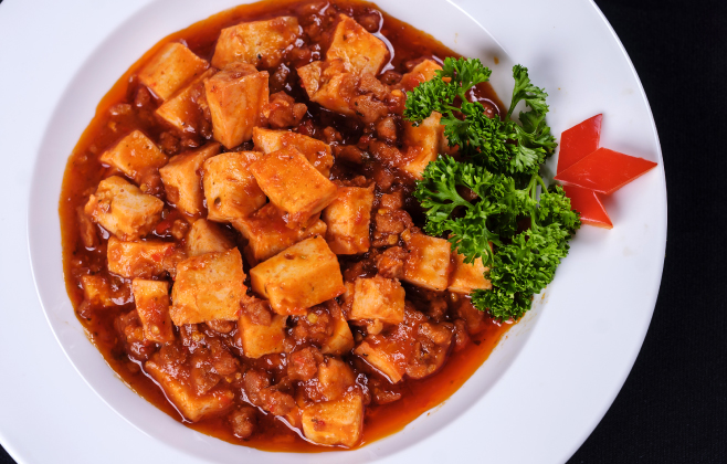 Braised tofu in tomato sauce (or dau hu sot ca chua) is a flavorful dish in vegan meals