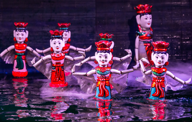 Traditional Vietnamese performance water puppet theatre show in Hanoi